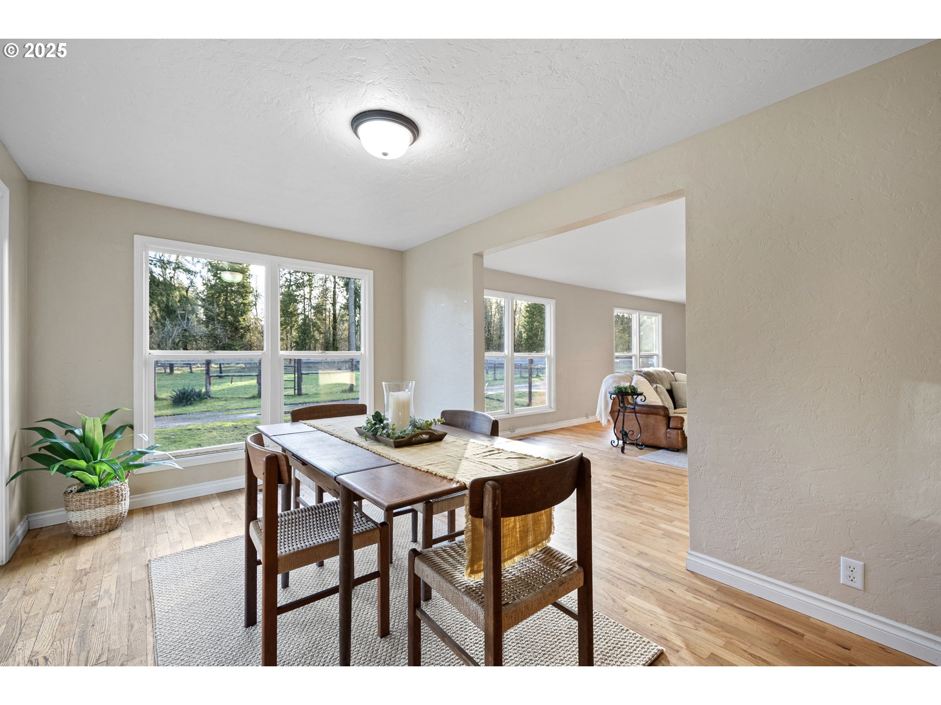 84020 Brown Road Dexter, OR 97431 - Photo 14 of 48 a view of a dining room with furniture and wooden floor
