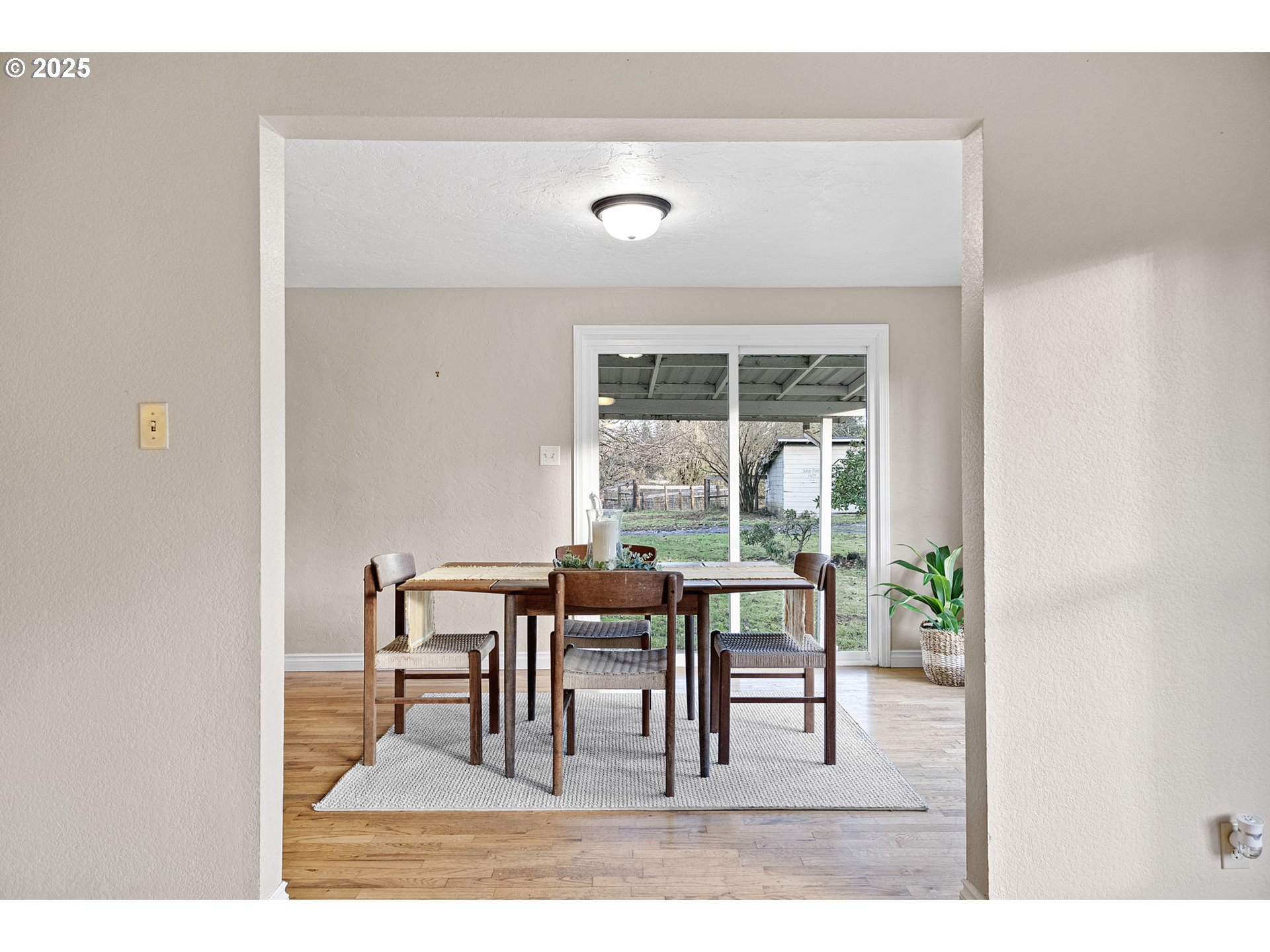 84020 Brown Road Dexter, OR 97431 - Photo 10 of 48 a view of a dining room with furniture and a large window