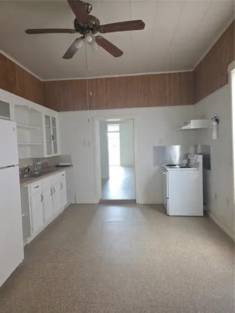 a view of a kitchen with a sink and cabinet