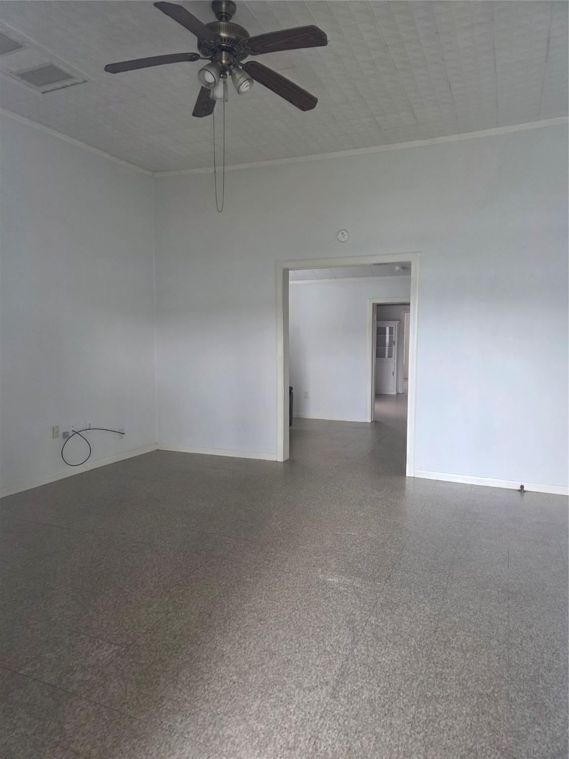 601 East Washington Avenue, Unit A Navasota, TX 77868 - Photo 3 of 17 a view of an empty room and chandelier fan