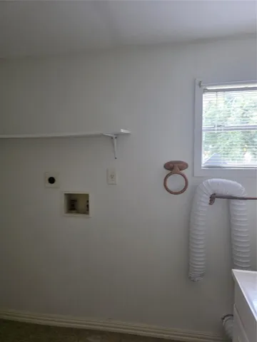 a bathroom with a shower and a window