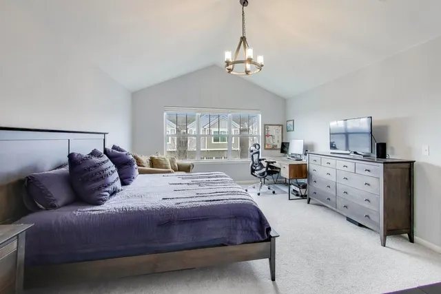 a bedroom with bed and window