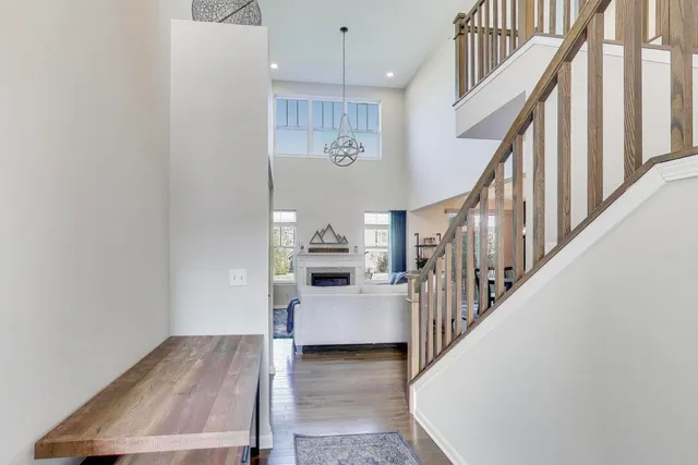 a view of entryway and hall with wooden floor