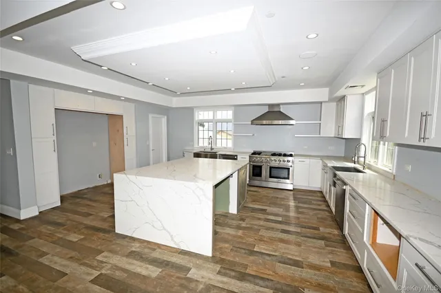 a kitchen with a stove a sink and a refrigerator