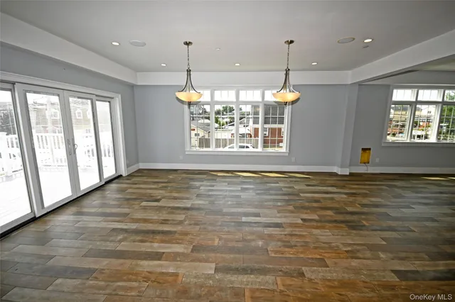 a utility room with kitchen island a stove a sink and a refrigerator