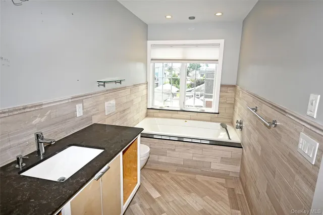 a view of balcony with wooden floor and fence