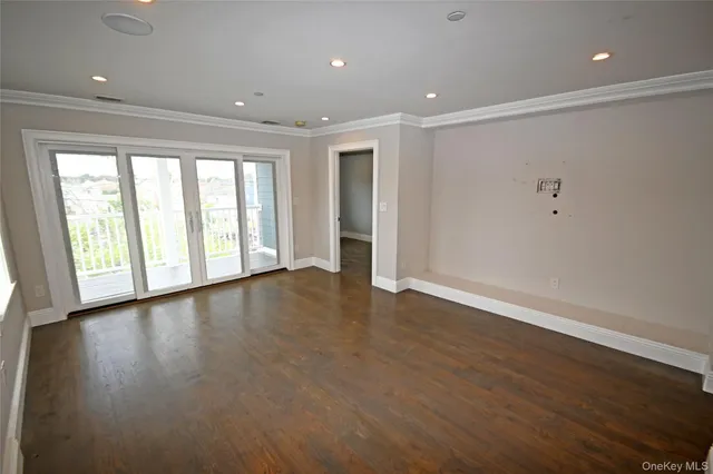 a kitchen with a stove a sink and a window