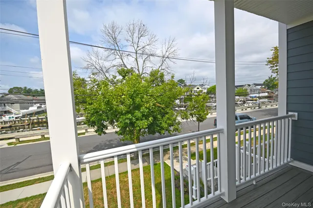 a view of a balcony with wooden floor