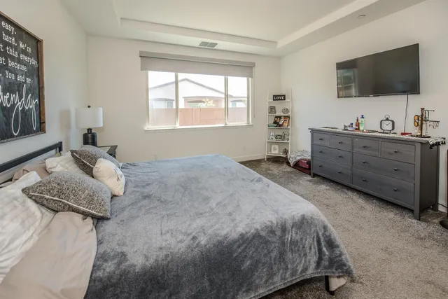 a spacious bathroom with a granite countertop sink mirror and toilet