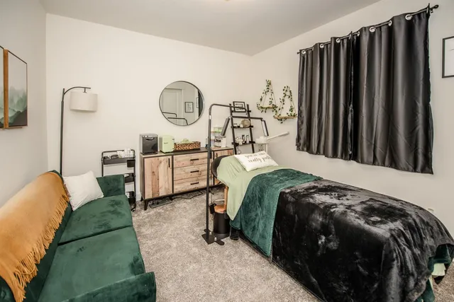 a bathroom with a sink a toilet and shower curtain