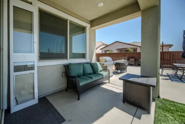 a view of a backyard with a fence