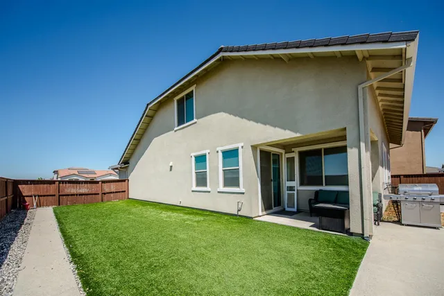 a backyard of a house with lots of green space