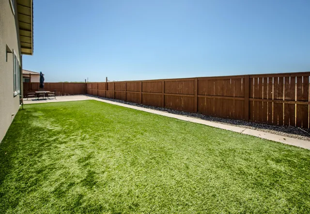 a view of a terrace with wooden fence