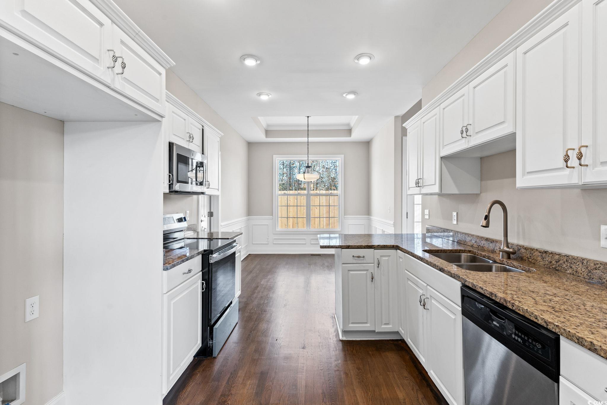 446 Sterling Drive Florence, SC 29501 - Photo 13 of 40 Kitchen featuring dark stone counters, sink, white