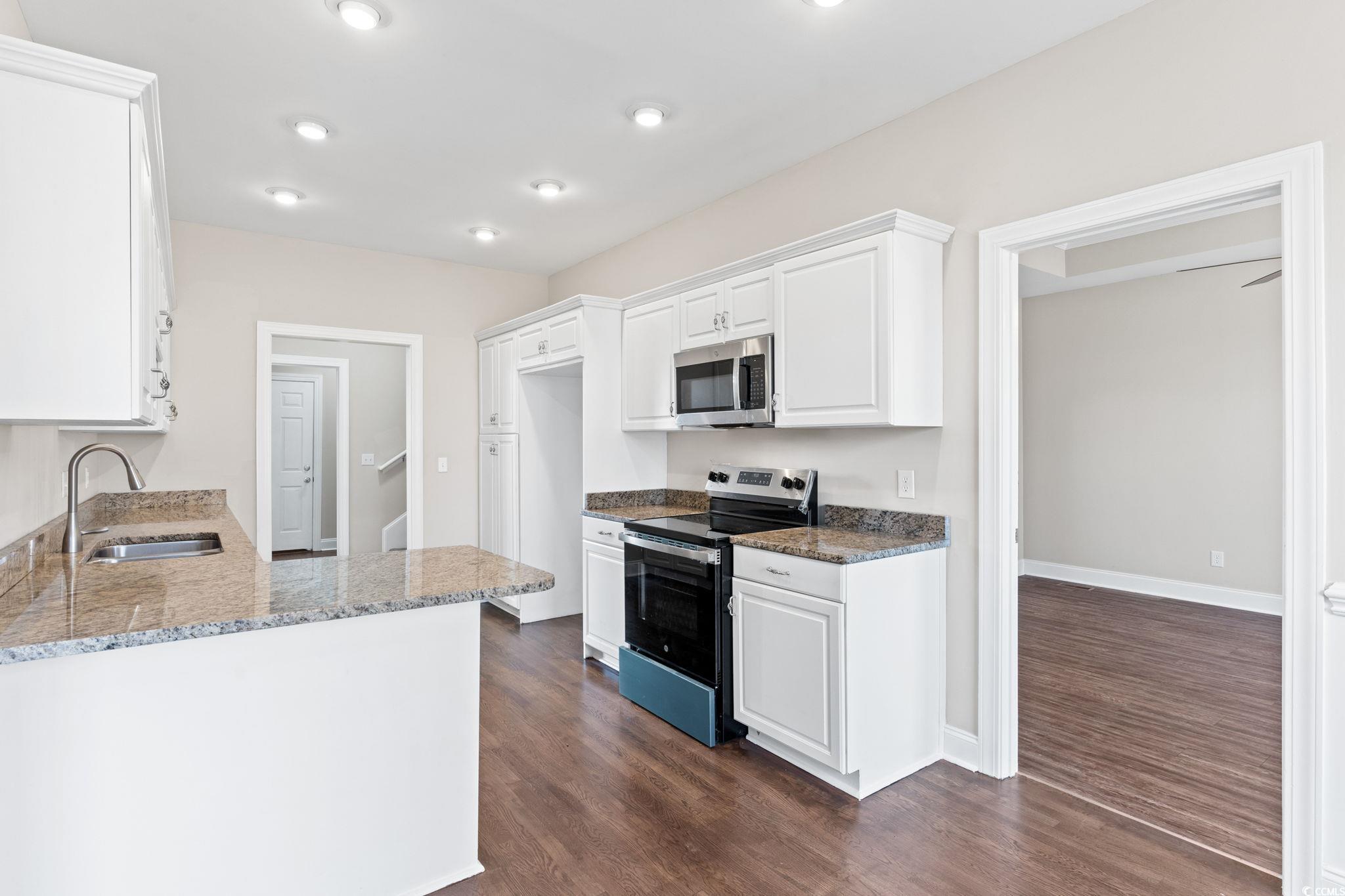 446 Sterling Drive Florence, SC 29501 - Photo 15 of 40 Kitchen with dark wood-type flooring, sink, light