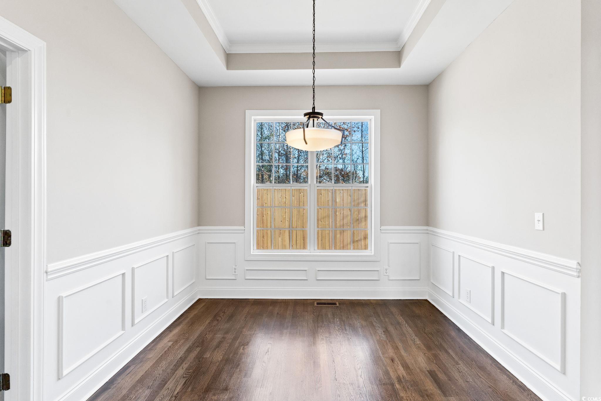 446 Sterling Drive Florence, SC 29501 - Photo 16 of 40 Unfurnished dining area featuring a tray ceiling,