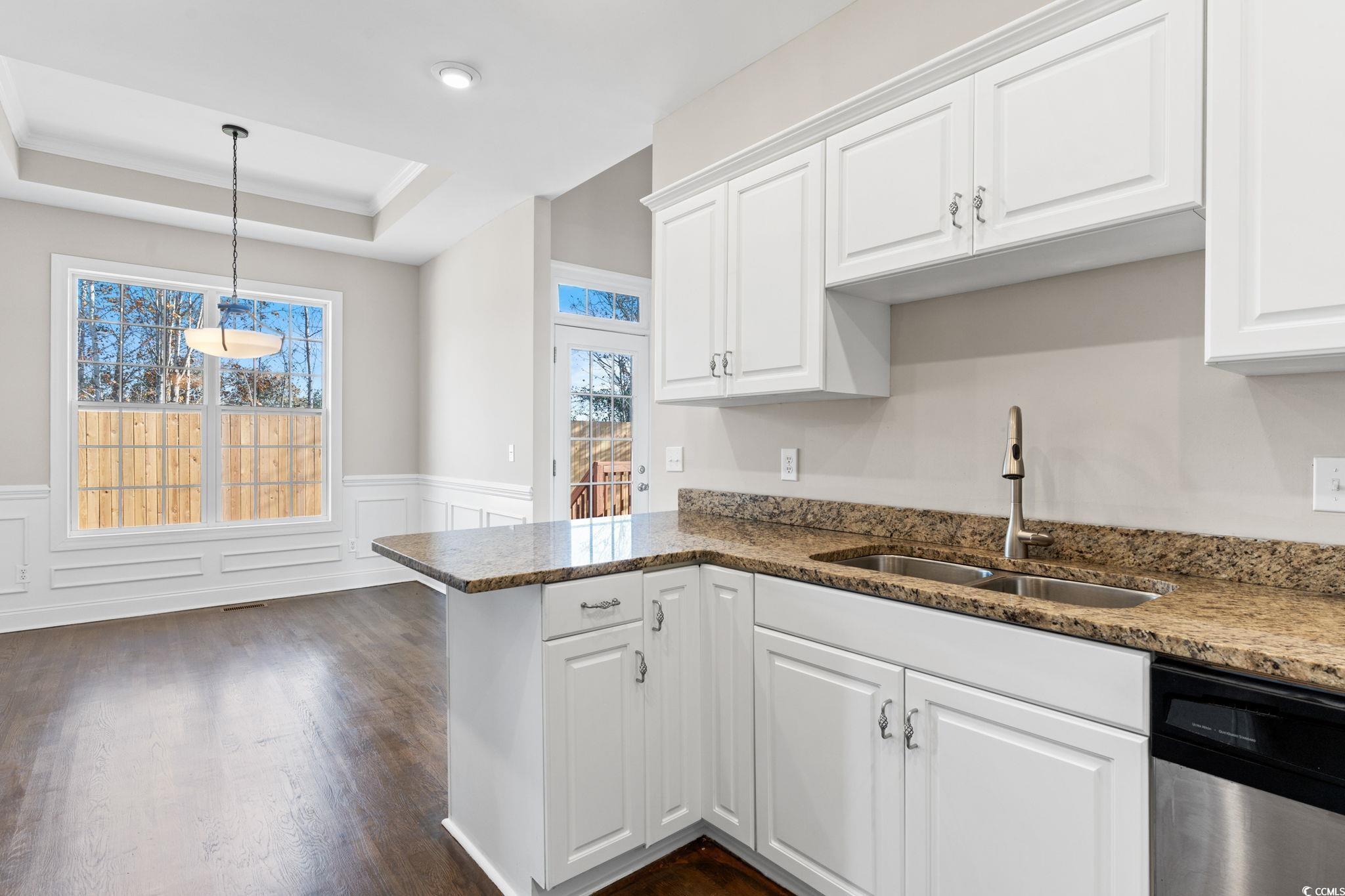 446 Sterling Drive Florence, SC 29501 - Photo 18 of 40 Kitchen featuring white cabinets, dark hardwood /