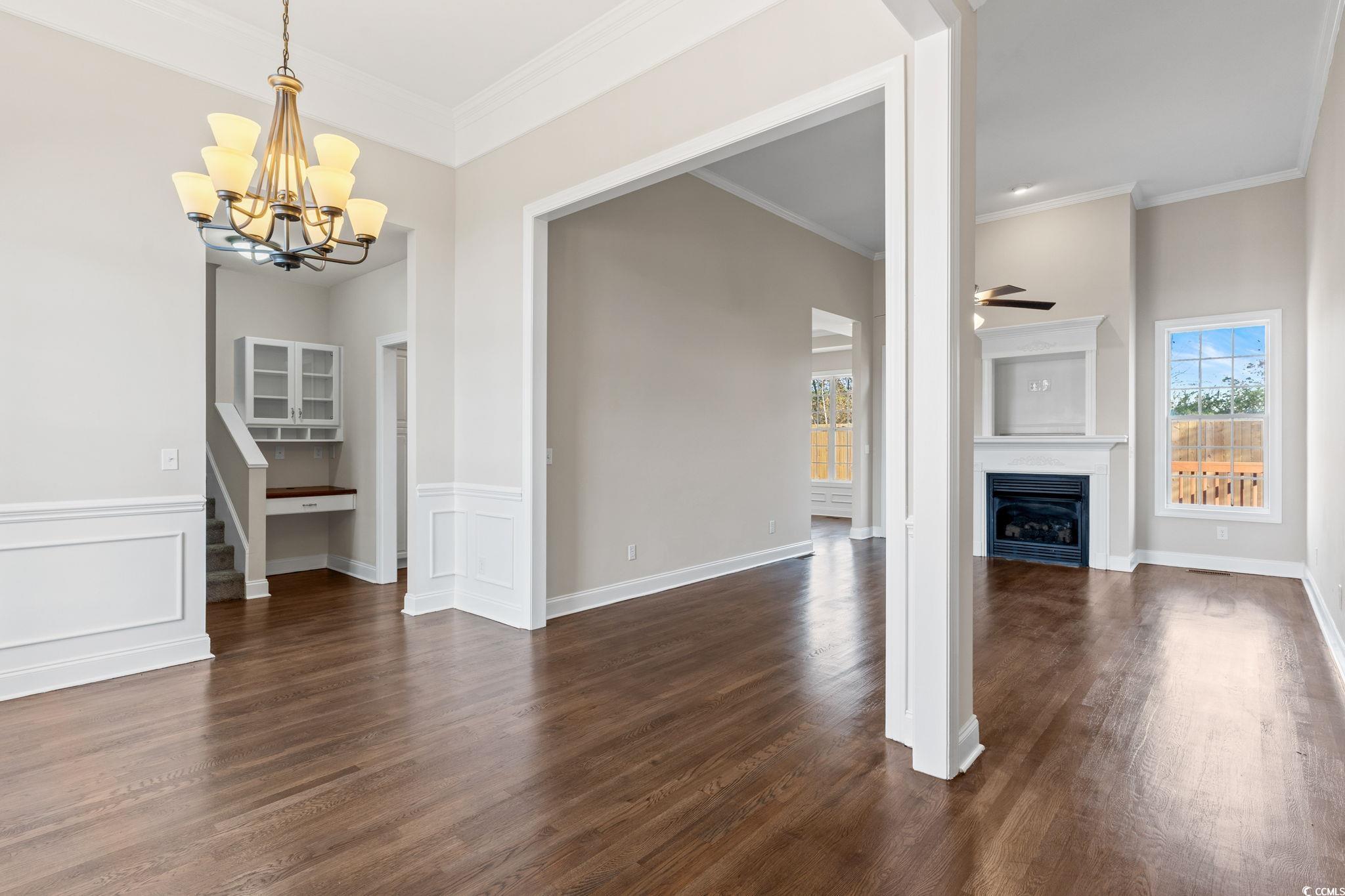 446 Sterling Drive Florence, SC 29501 - Photo 20 of 40 Unfurnished living room featuring crown molding, d