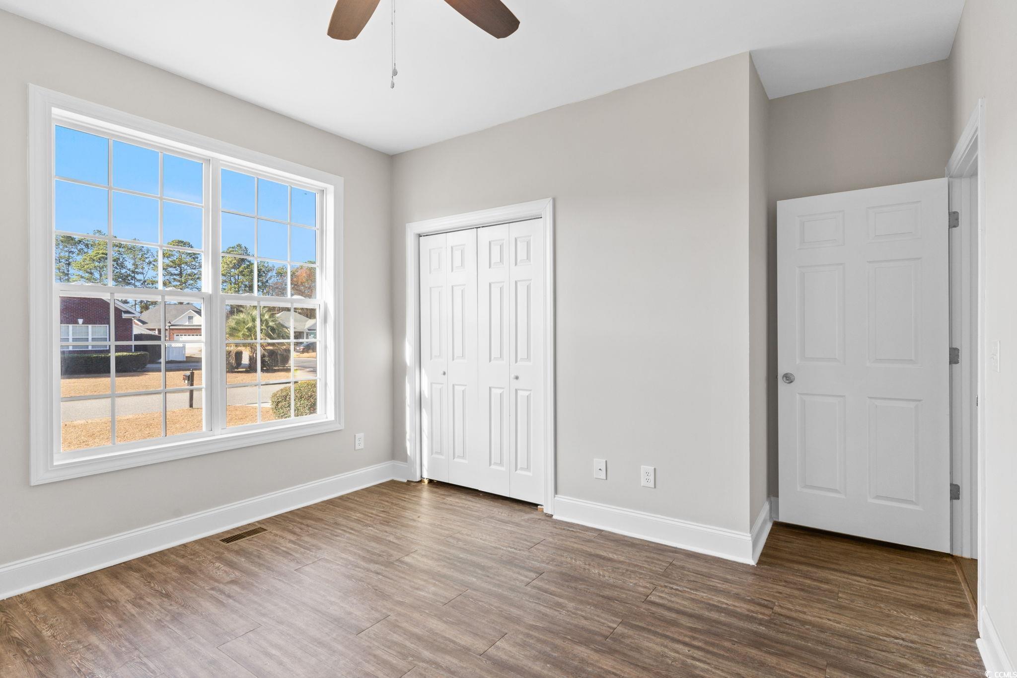 446 Sterling Drive Florence, SC 29501 - Photo 31 of 40 Unfurnished bedroom with ceiling fan, a closet, an