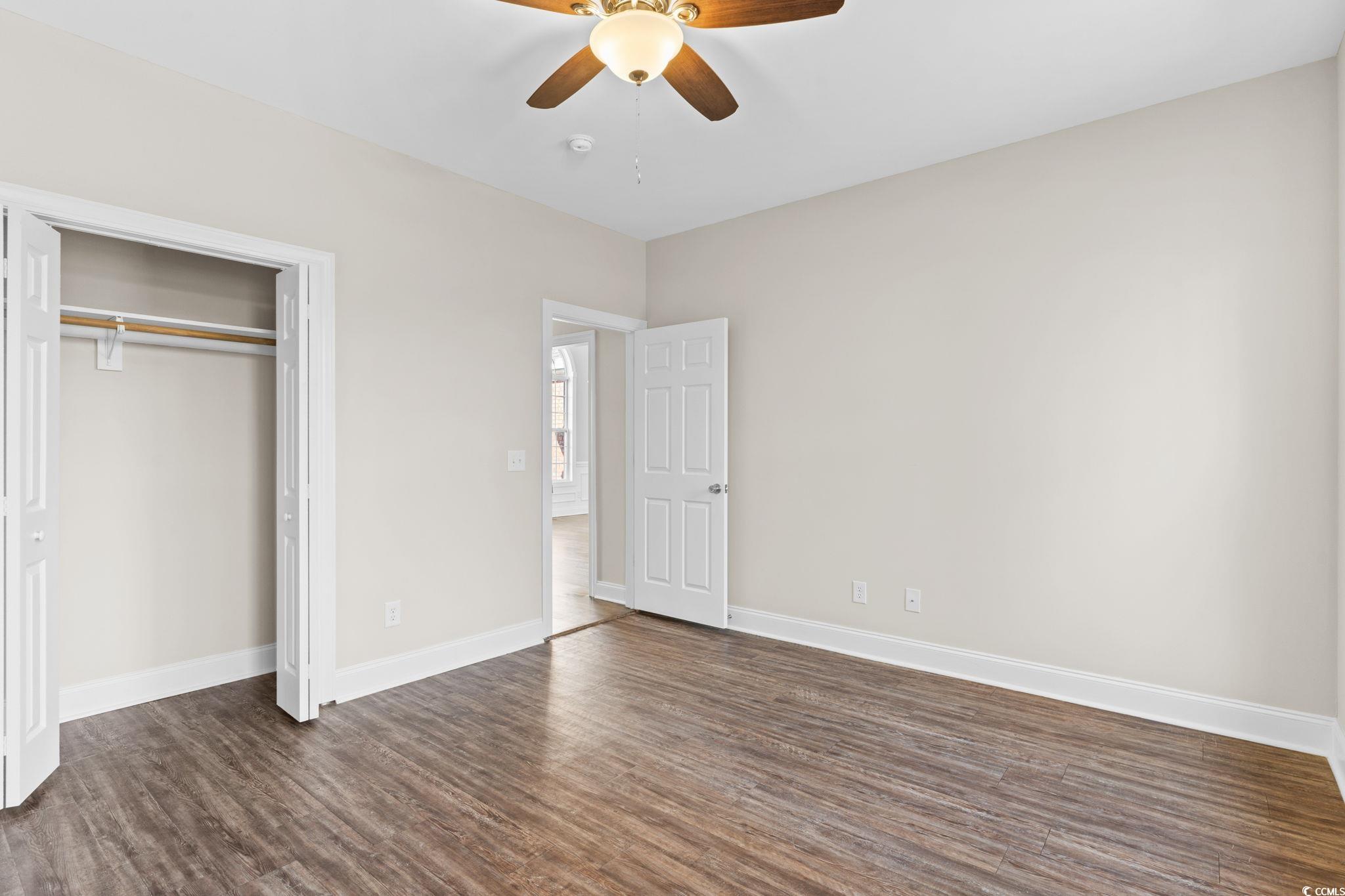 446 Sterling Drive Florence, SC 29501 - Photo 33 of 40 Unfurnished bedroom with a closet, dark hardwood /