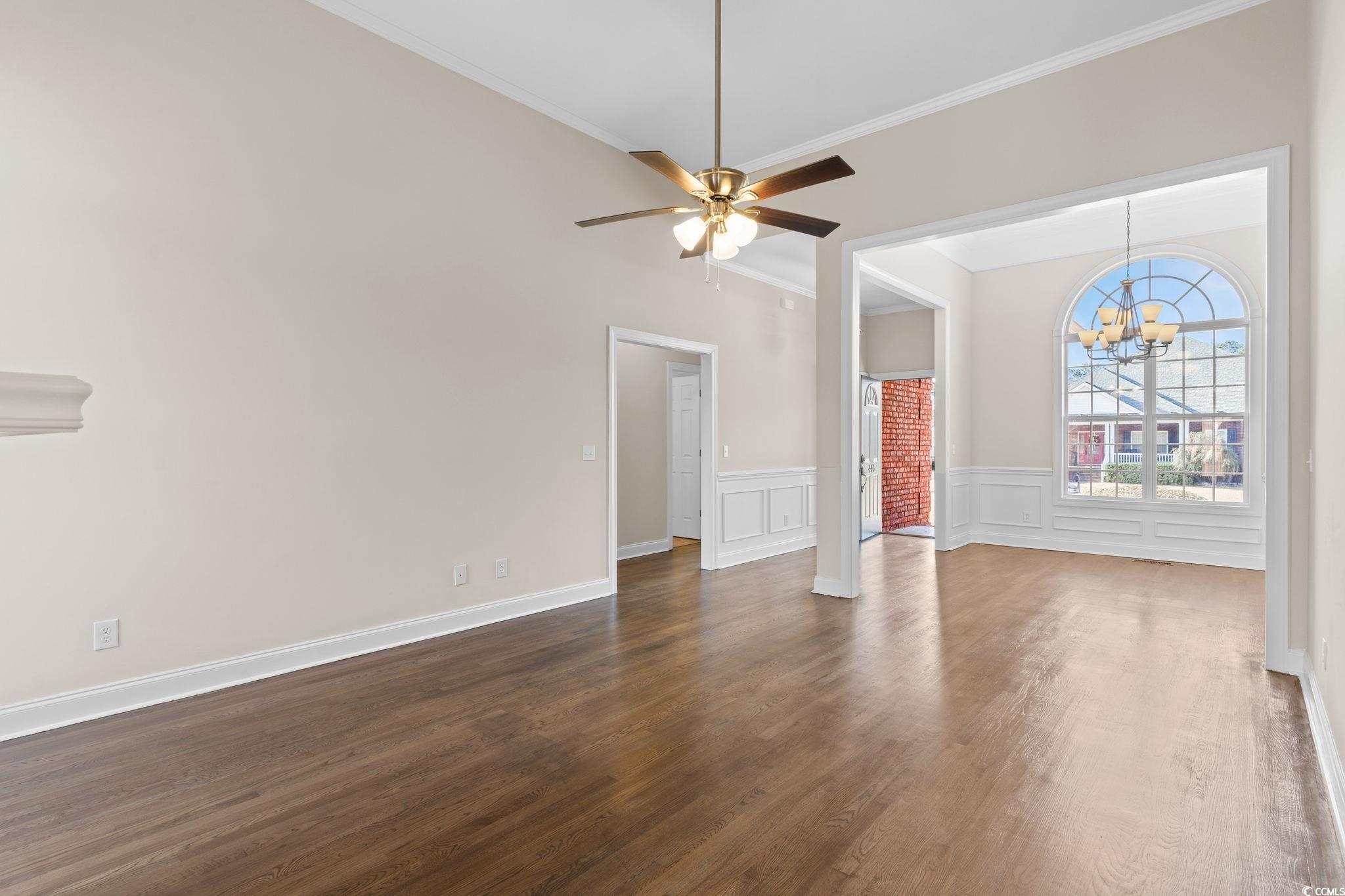 446 Sterling Drive Florence, SC 29501 - Photo 6 of 40 Unfurnished living room featuring ceiling fan with