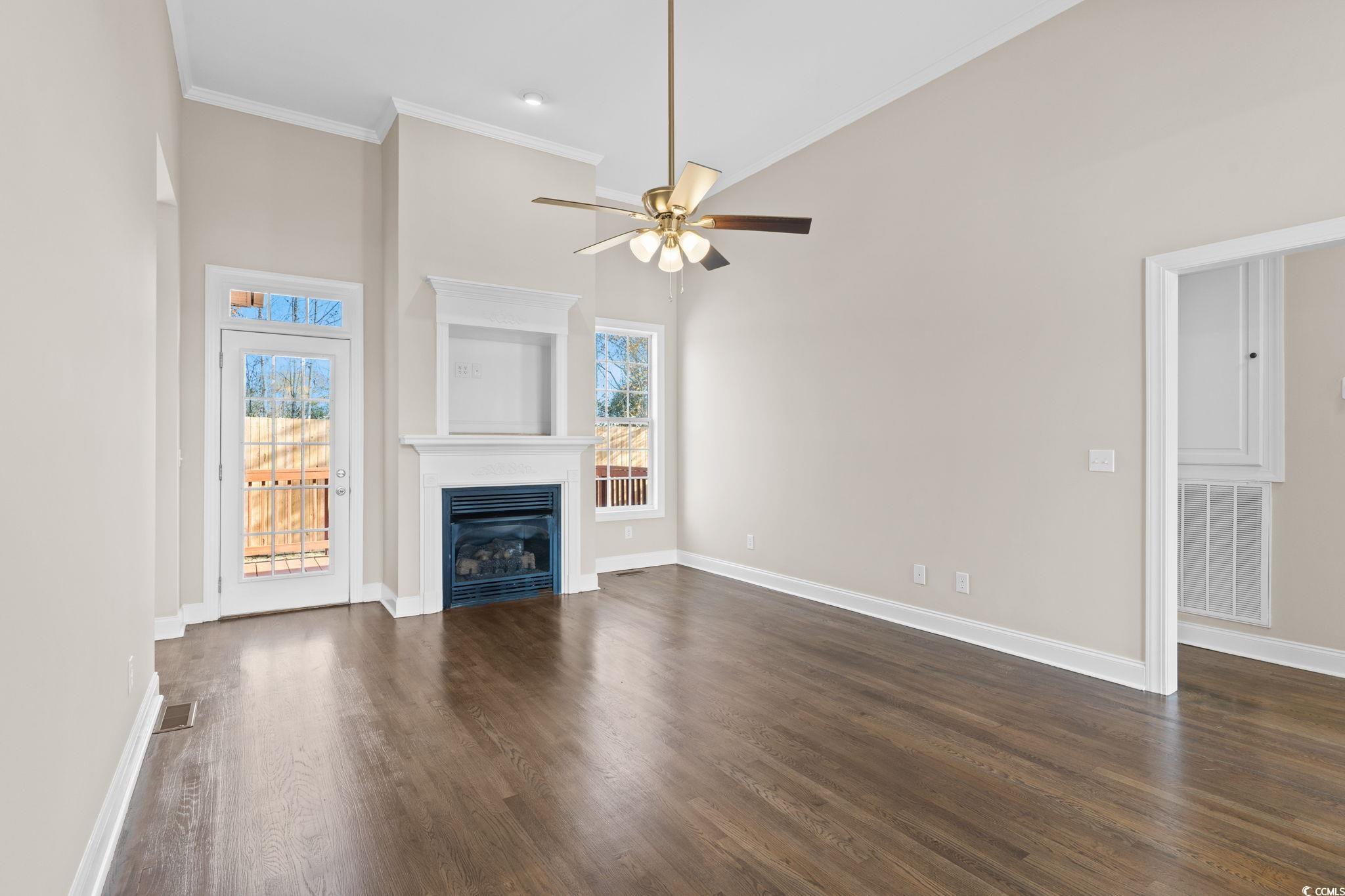 446 Sterling Drive Florence, SC 29501 - Photo 7 of 40 Unfurnished living room featuring ceiling fan, dar