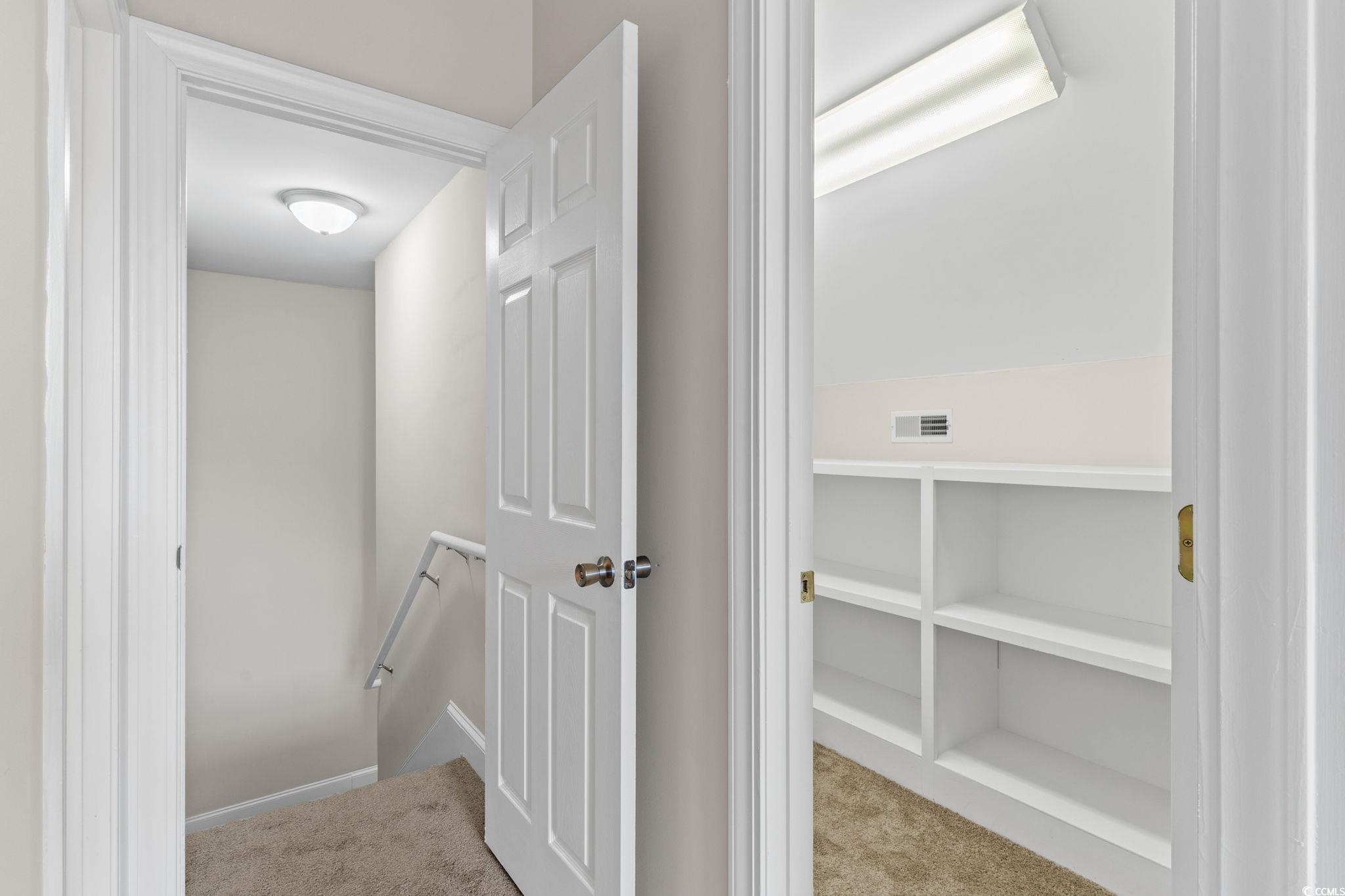 446 Sterling Drive Florence, SC 29501 - Photo 8 of 40 Hallway featuring light colored carpet