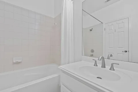 a bathroom with a sink and a bathtub