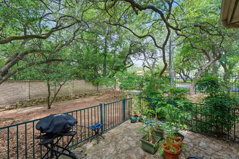 a view of balcony with furniture and trees
