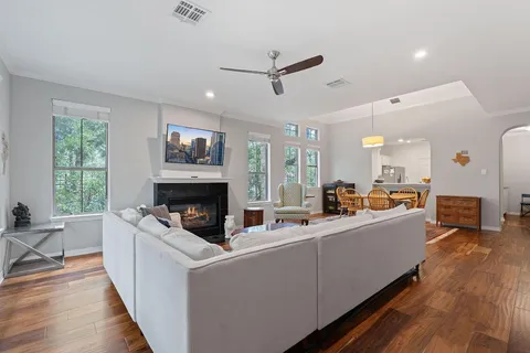 a living room with furniture and a fireplace