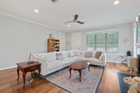 a living room with furniture or couch and a large window