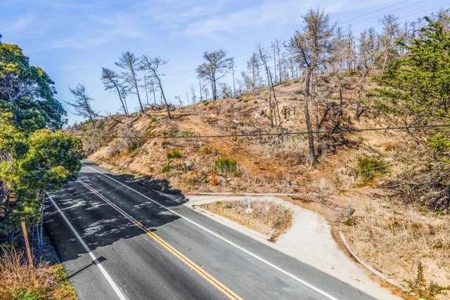 a view of mountain with sunset
