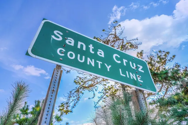 a view of a dirt road with a building in the background