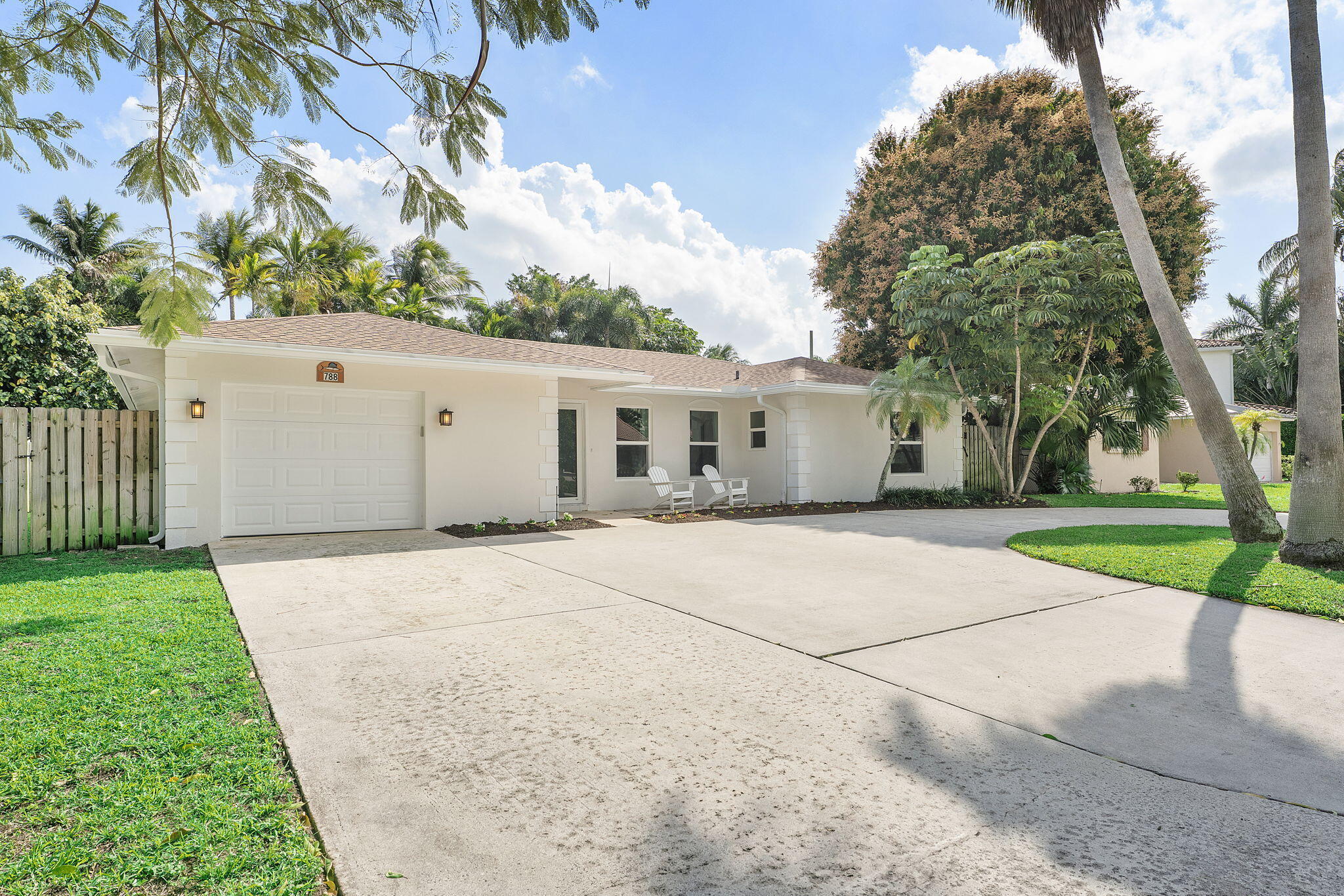 788 Northwest 7th Drive Boca Raton, FL 33486 - Photo 1 of 46 a view of garage yard and tree