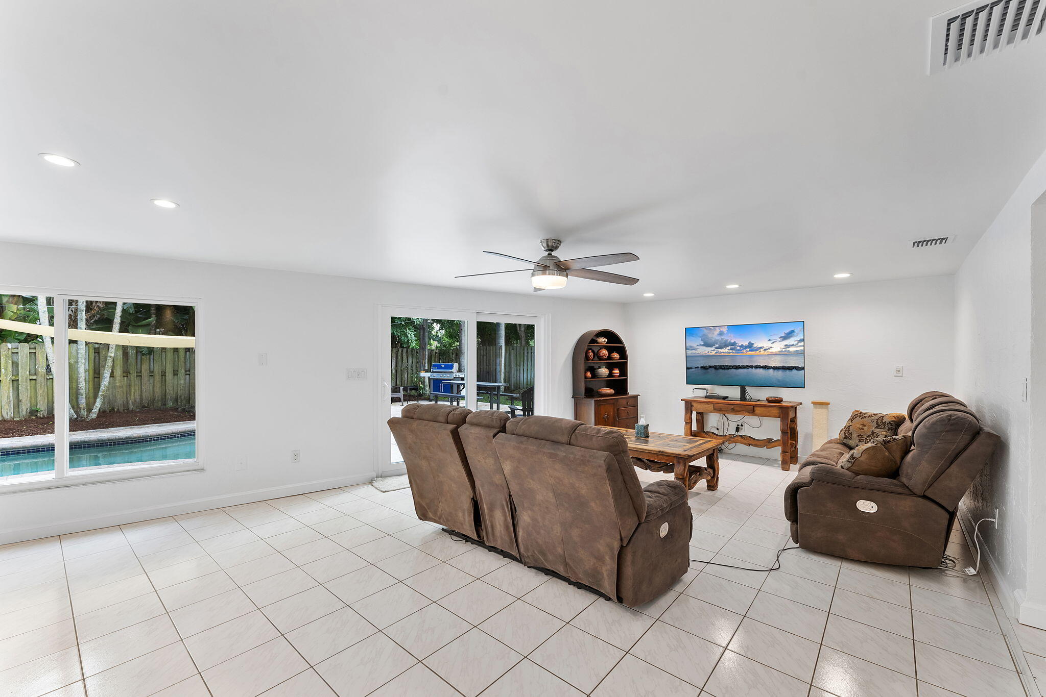 788 Northwest 7th Drive Boca Raton, FL 33486 - Photo 14 of 46 a living room with furniture and a large window