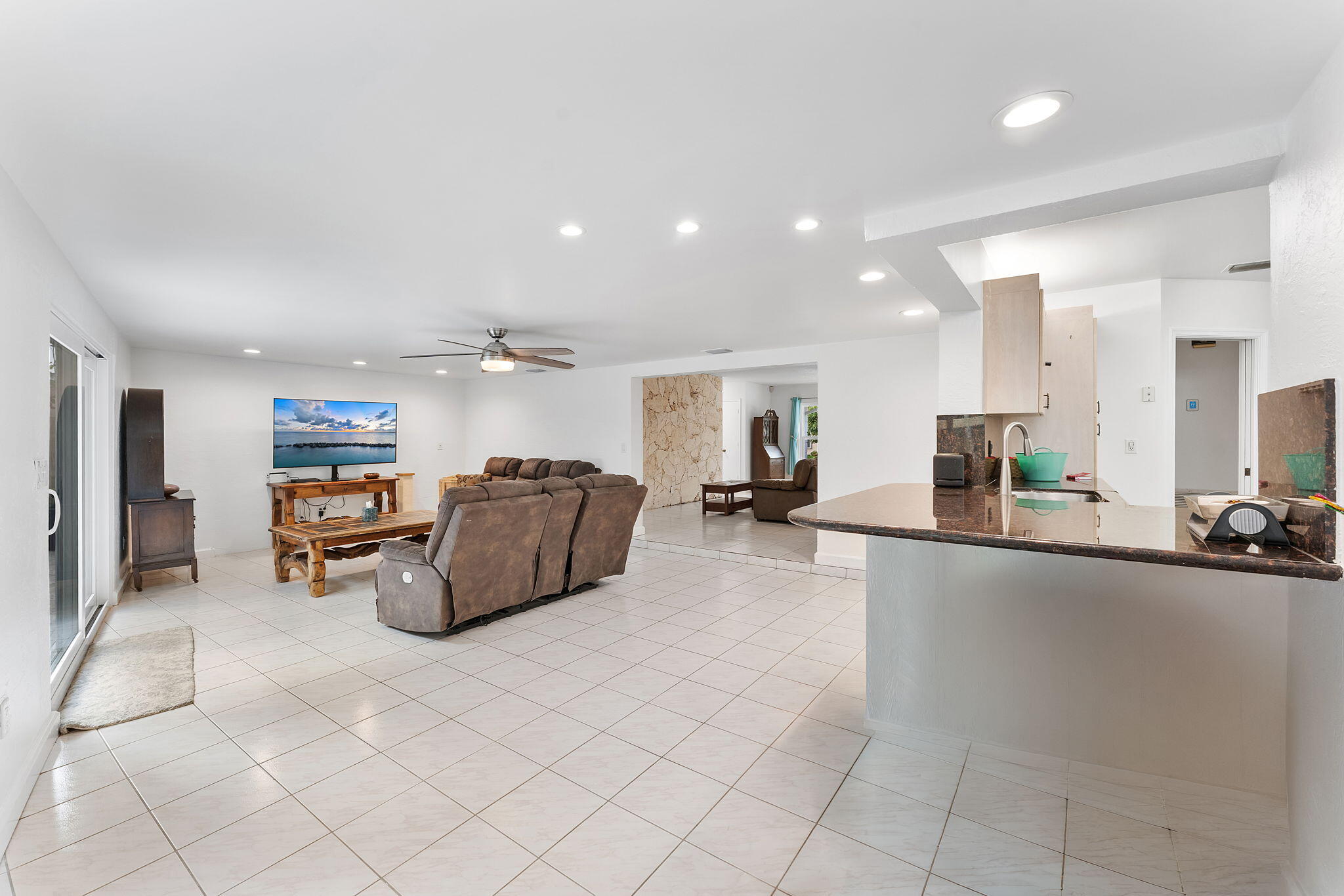 788 Northwest 7th Drive Boca Raton, FL 33486 - Photo 16 of 46 a living room with furniture and a flat screen tv