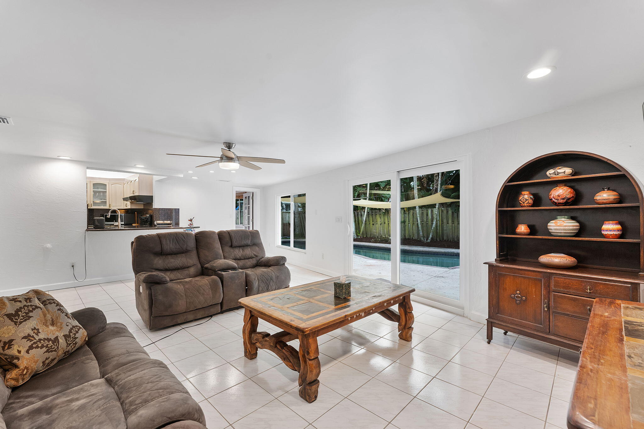 788 Northwest 7th Drive Boca Raton, FL 33486 - Photo 17 of 46 a living room with furniture and a chandelier