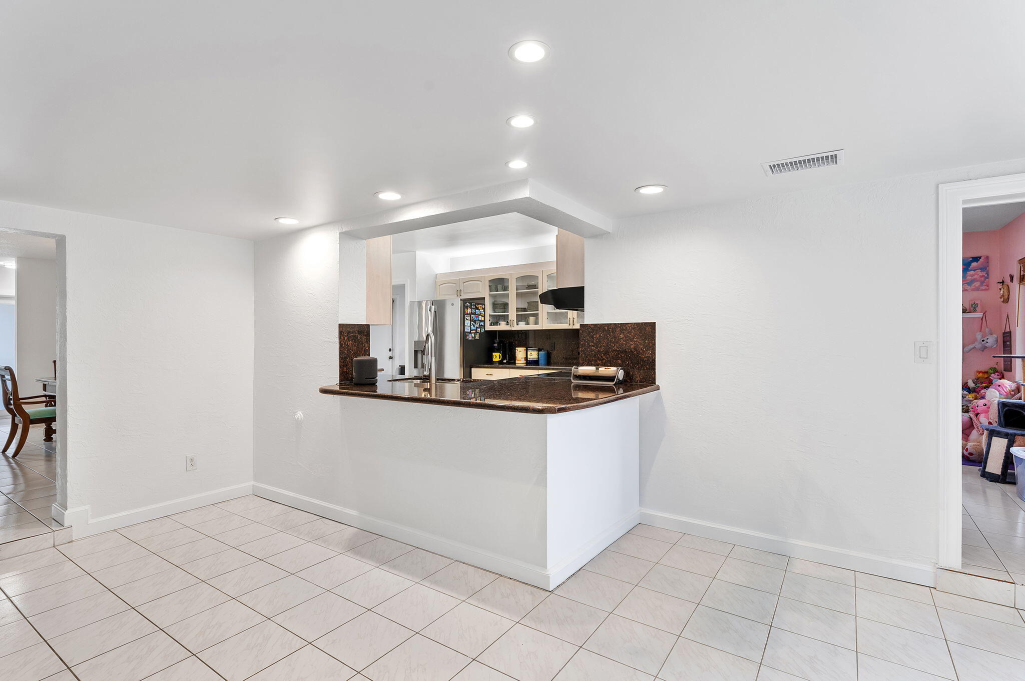 788 Northwest 7th Drive Boca Raton, FL 33486 - Photo 18 of 46 a kitchen with stainless steel appliances granite countertop a sink and a refrigerator
