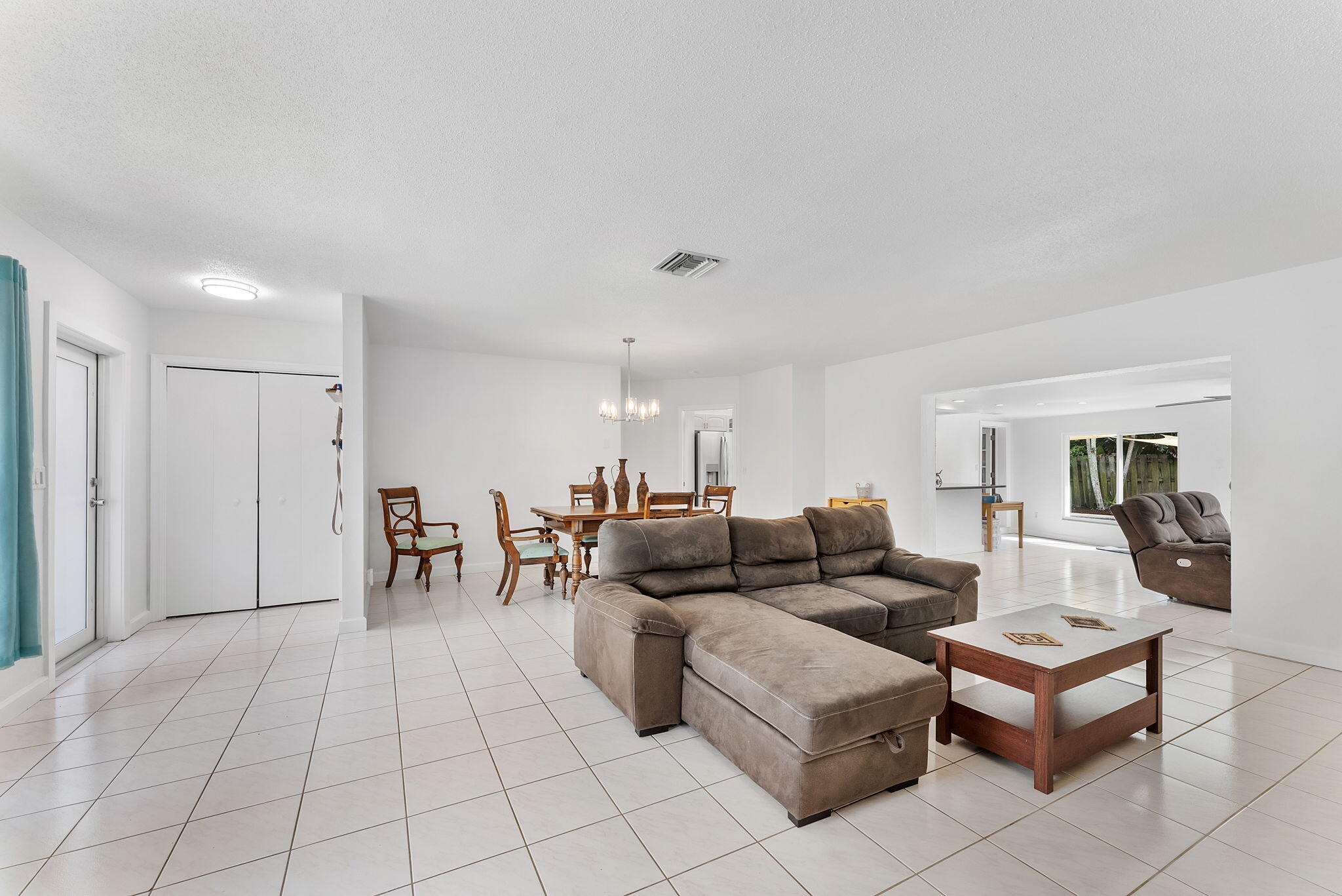 788 Northwest 7th Drive Boca Raton, FL 33486 - Photo 19 of 46 a living room with furniture and a table