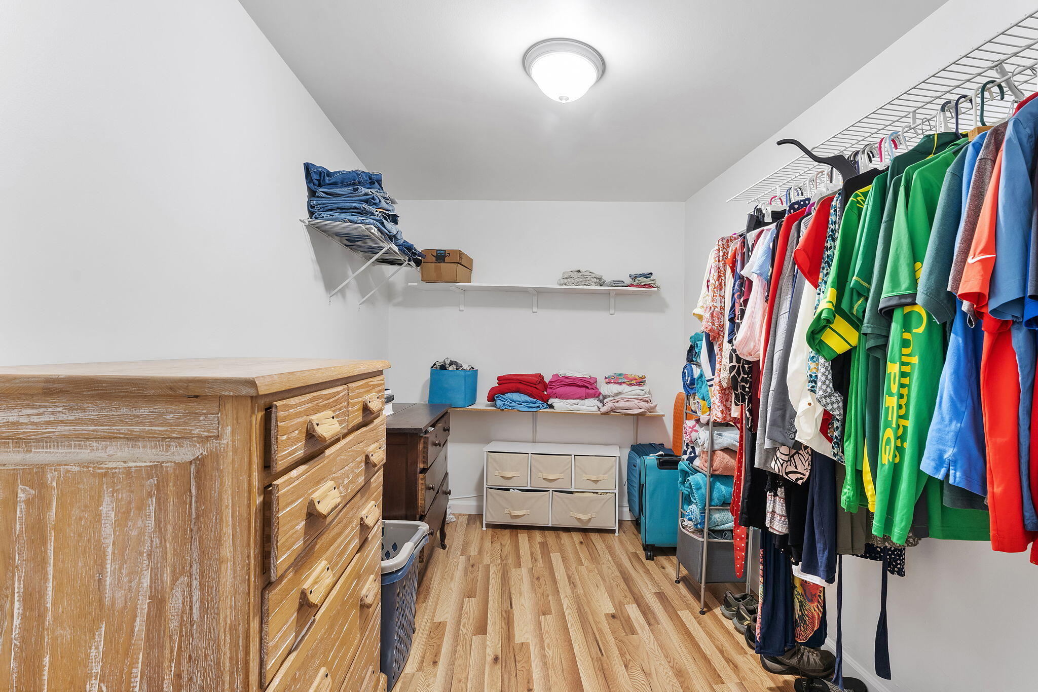 788 Northwest 7th Drive Boca Raton, FL 33486 - Photo 22 of 46 a view of walk in closet with clothes and shoes