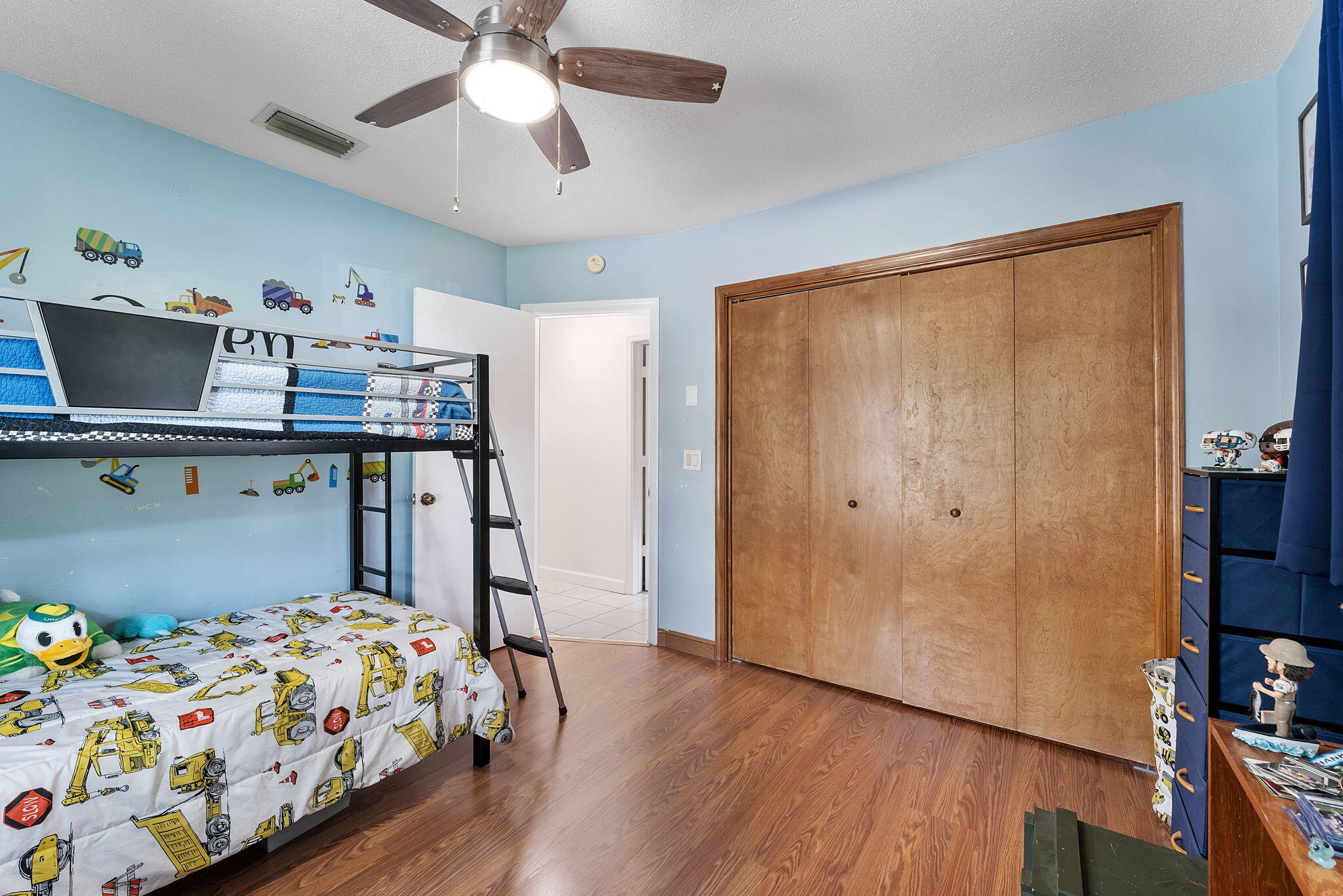 788 Northwest 7th Drive Boca Raton, FL 33486 - Photo 25 of 46 a bedroom with a bed and wooden floor