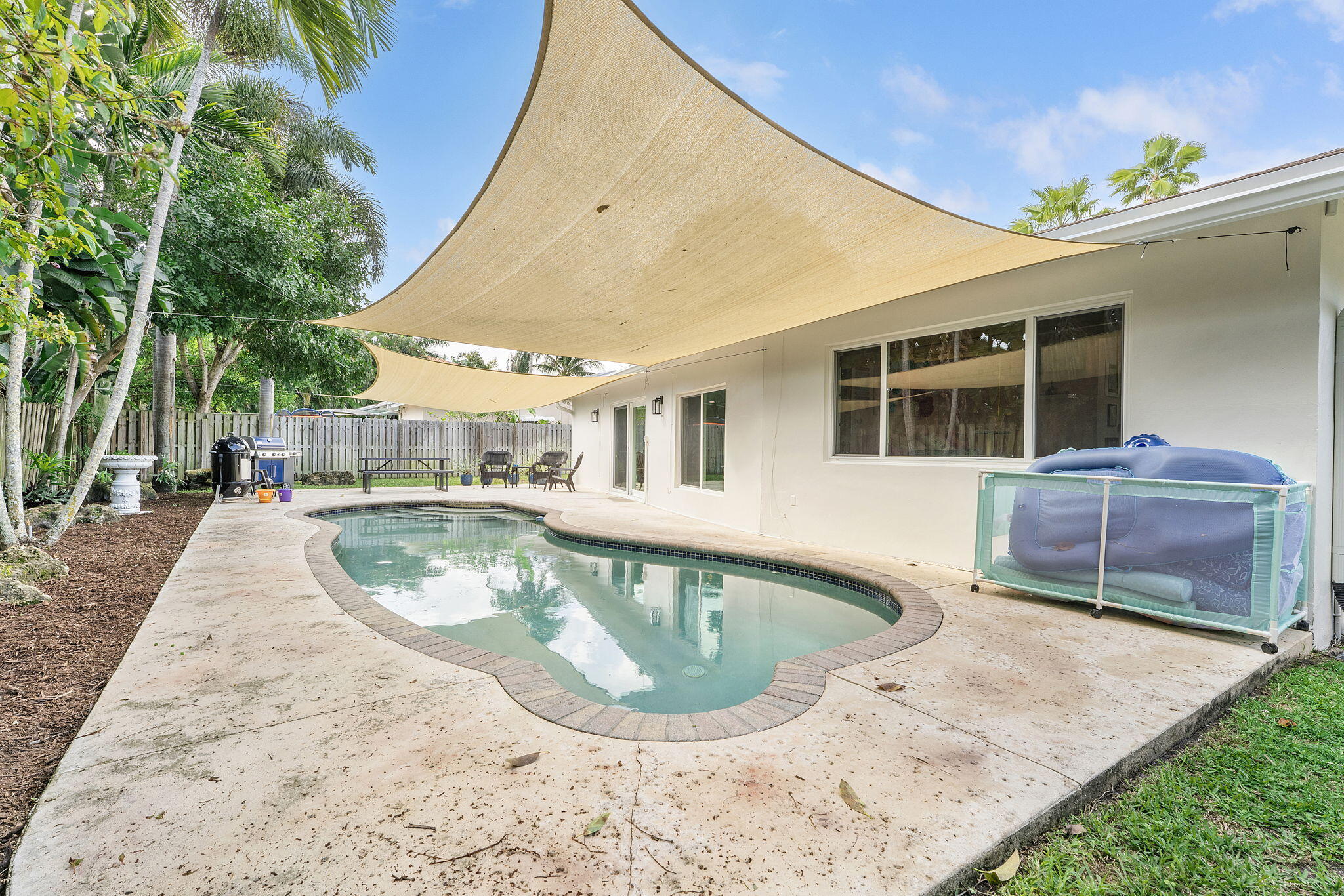 788 Northwest 7th Drive Boca Raton, FL 33486 - Photo 35 of 46 a view of a house with swimming pool and sitting area