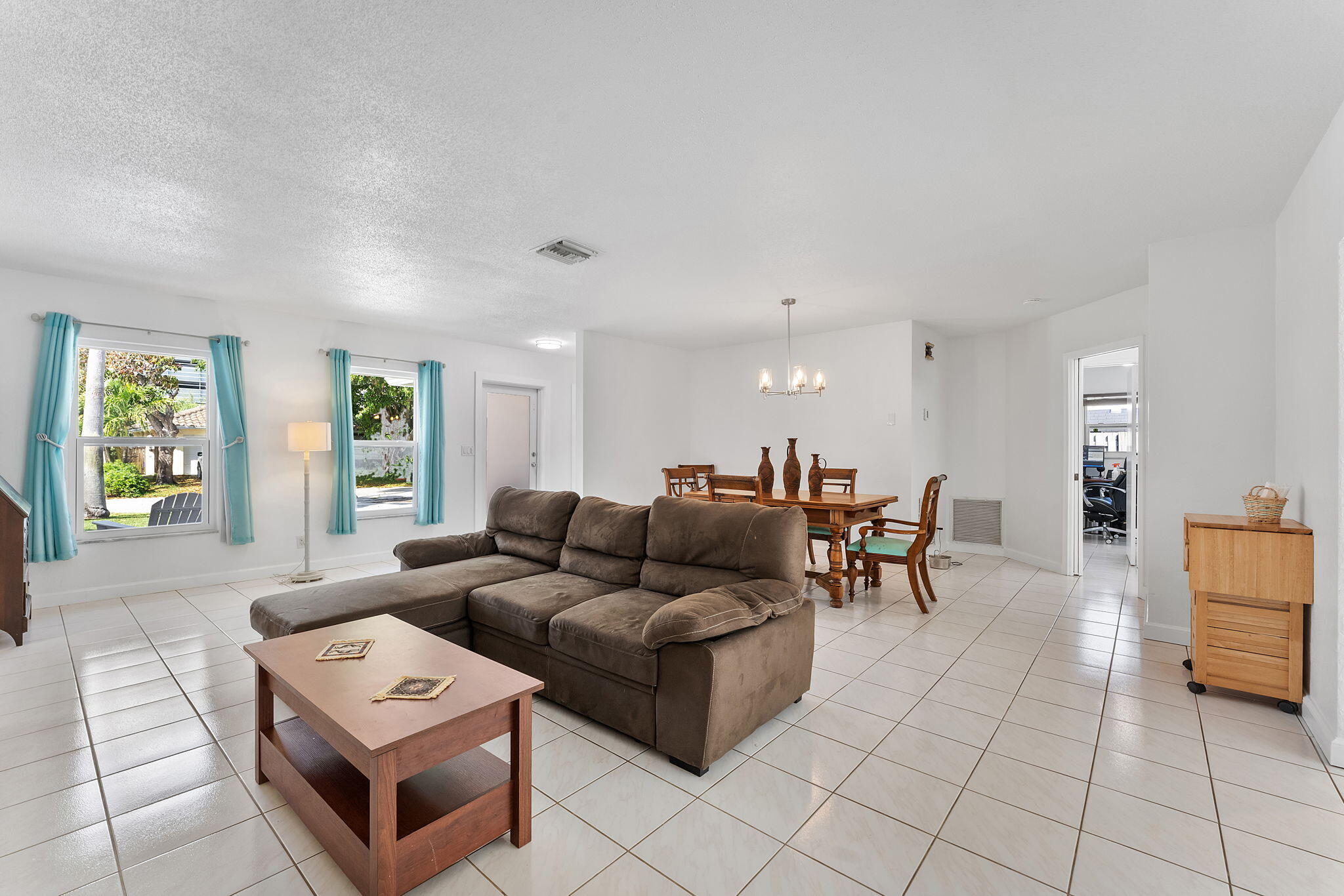 788 Northwest 7th Drive Boca Raton, FL 33486 - Photo 7 of 46 a living room with furniture and a window