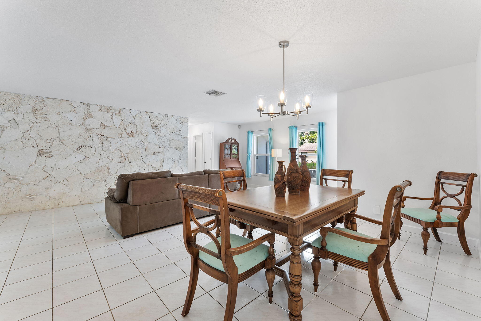 788 Northwest 7th Drive Boca Raton, FL 33486 - Photo 9 of 46 a dining room with furniture and chandelier