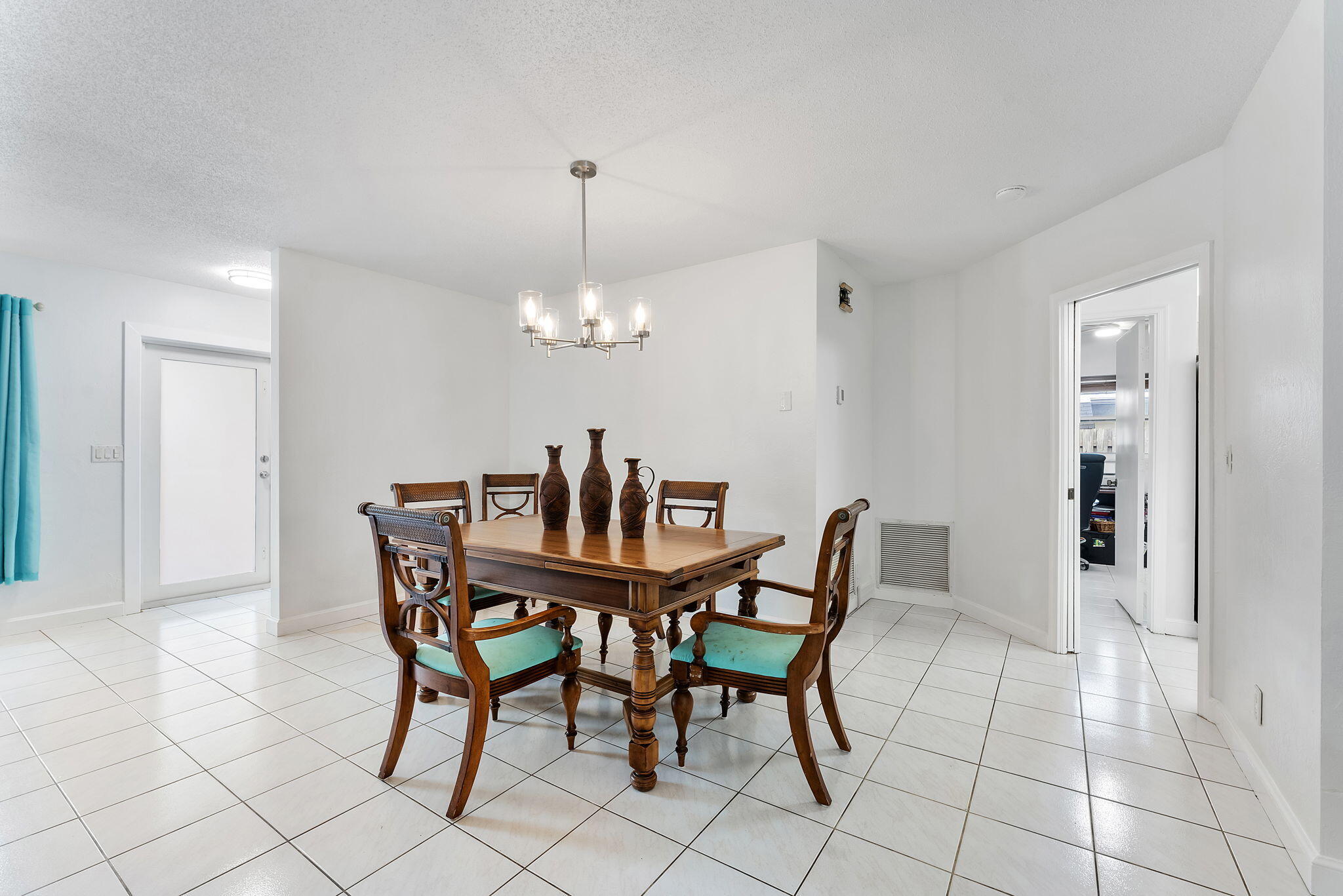 788 Northwest 7th Drive Boca Raton, FL 33486 - Photo 10 of 46 a view of a dining room with furniture and chandelier