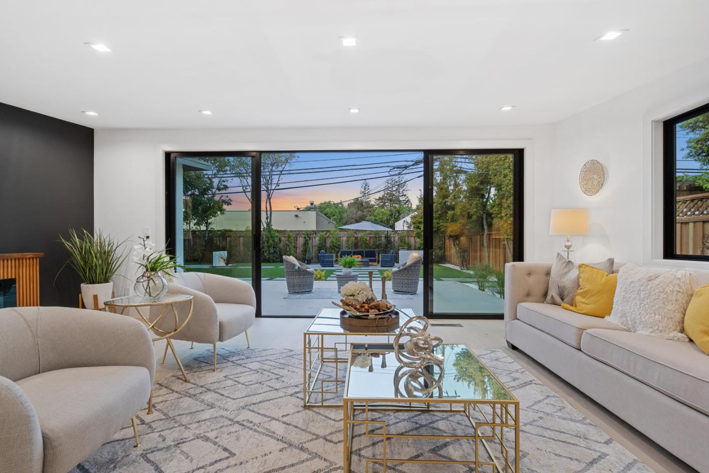 3633 Louis Road Palo Alto, CA 94303 - Photo 11 of 42 a living room with furniture and a large window