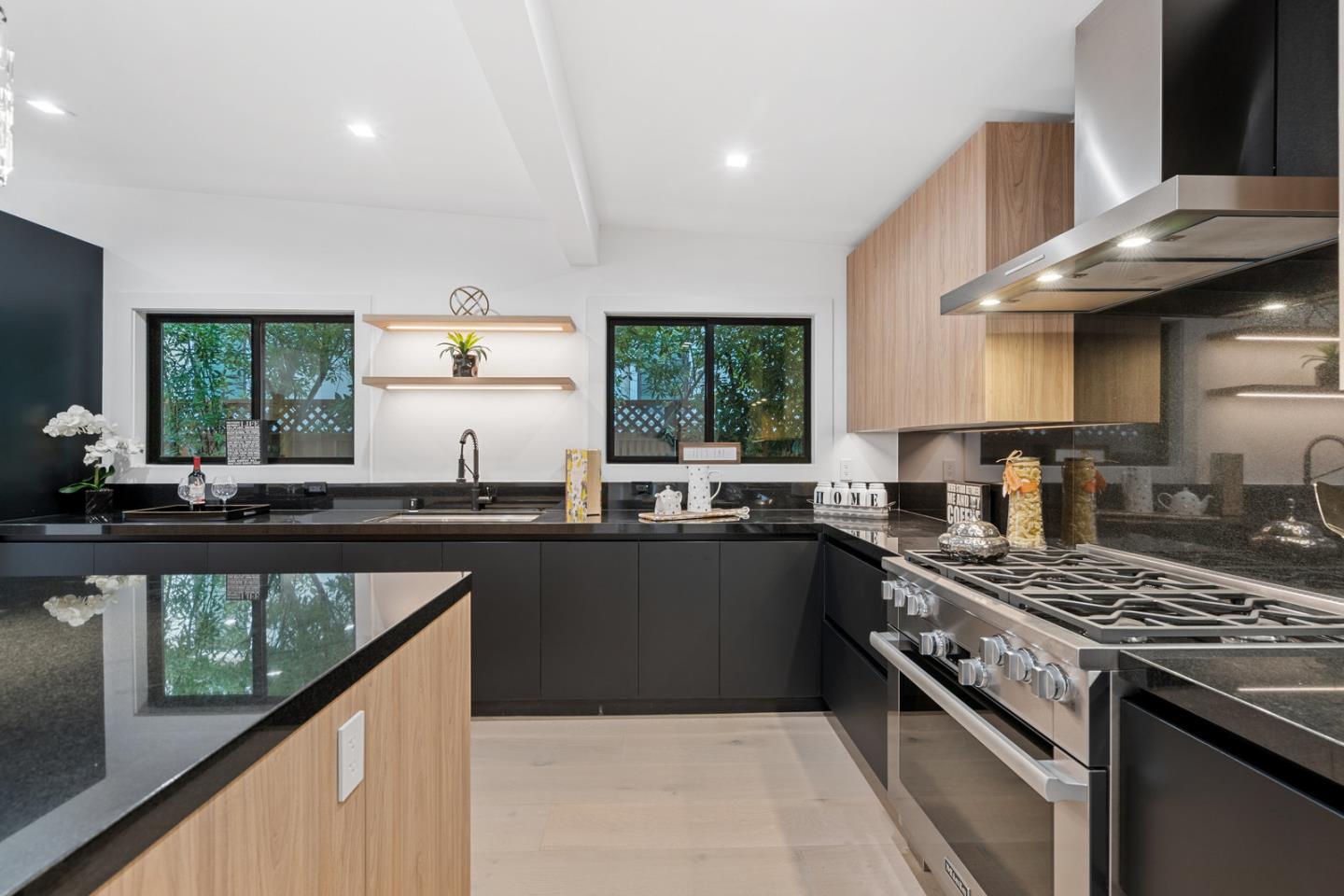 3633 Louis Road Palo Alto, CA 94303 - Photo 15 of 42 a kitchen with stainless steel appliances granite countertop a stove a sink dishwasher and cabinets with wooden floor