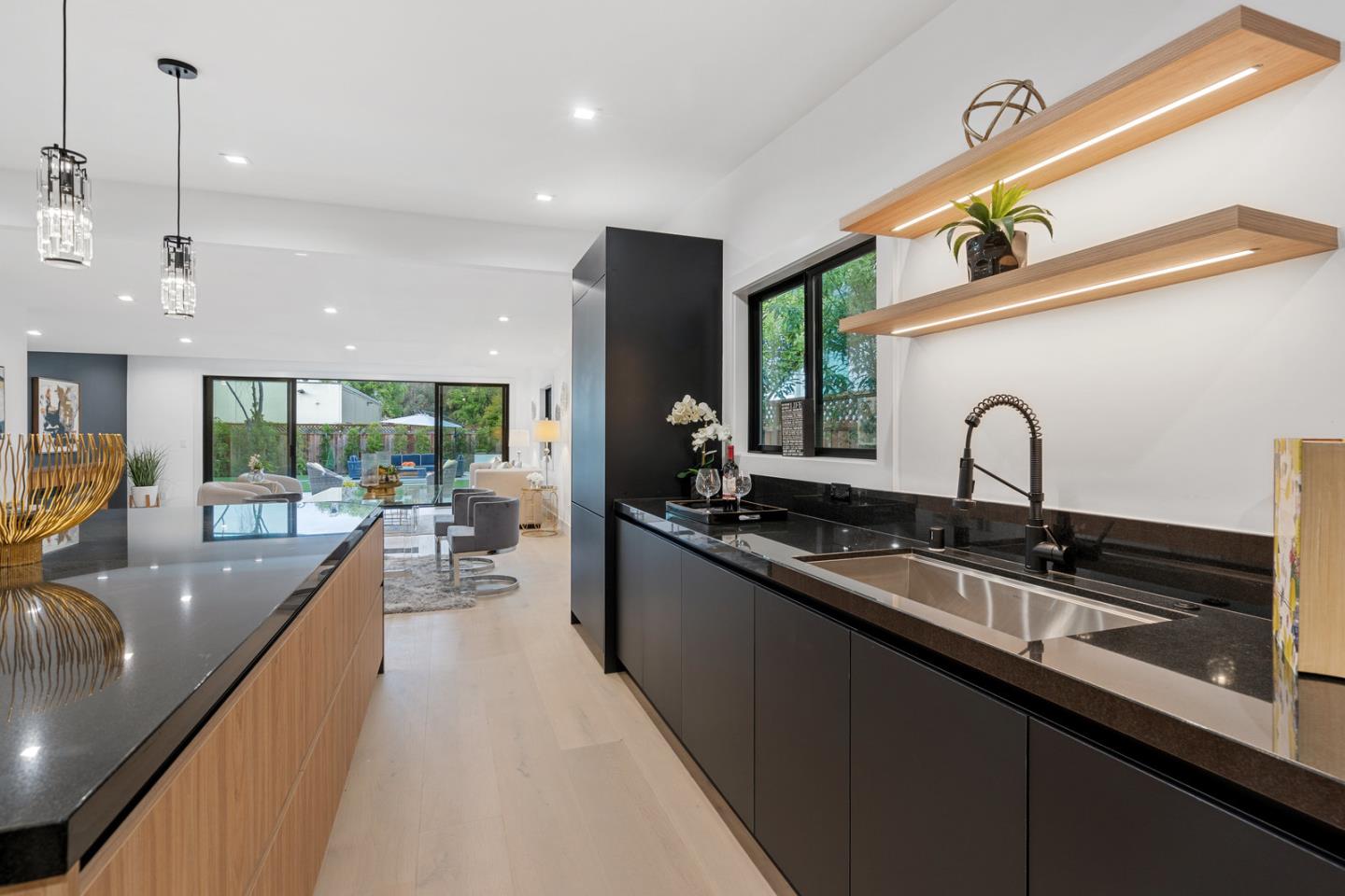 3633 Louis Road Palo Alto, CA 94303 - Photo 16 of 42 a large kitchen with sink and lots of counter space