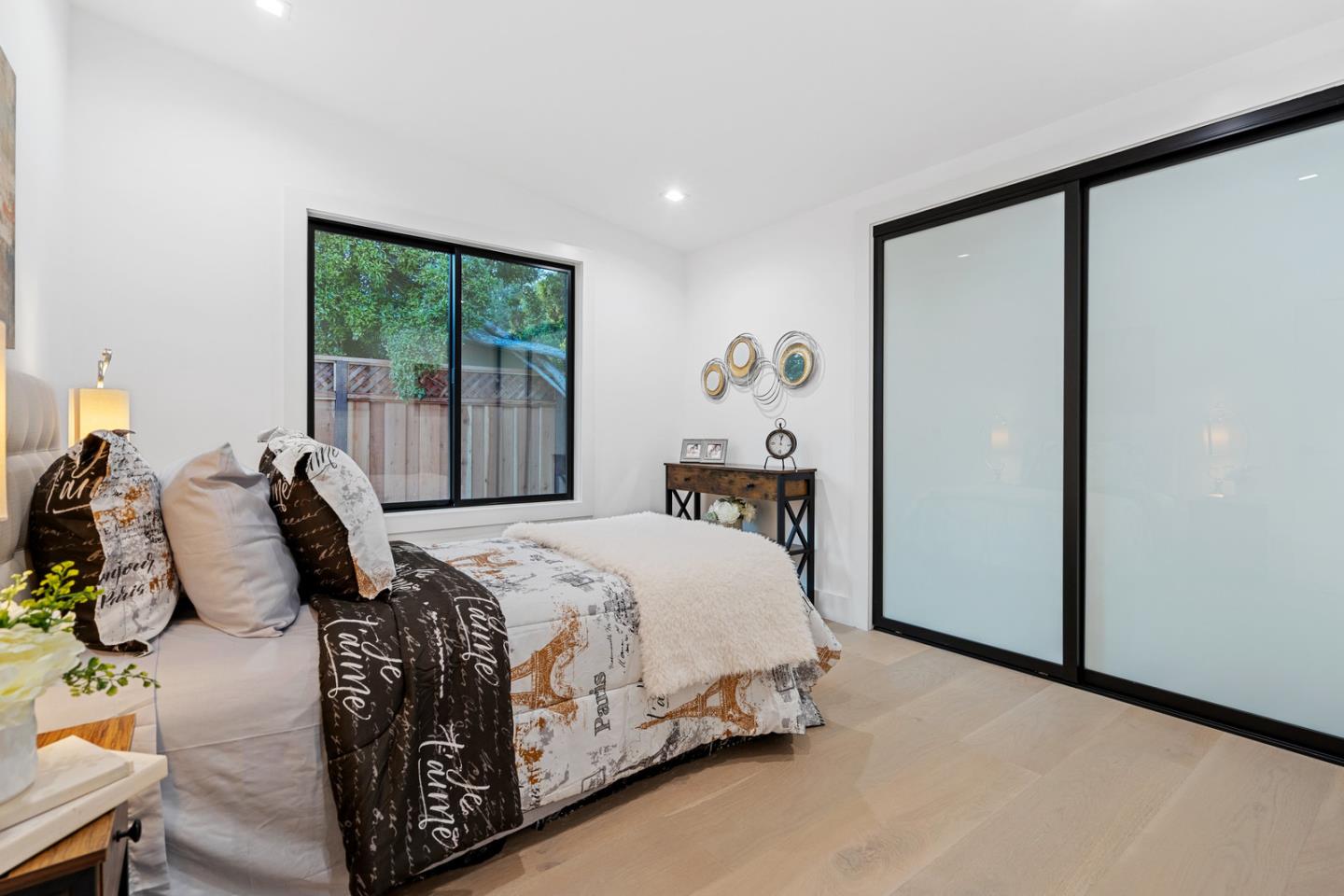 3633 Louis Road Palo Alto, CA 94303 - Photo 20 of 42 a bedroom with a bed window and a wall painting