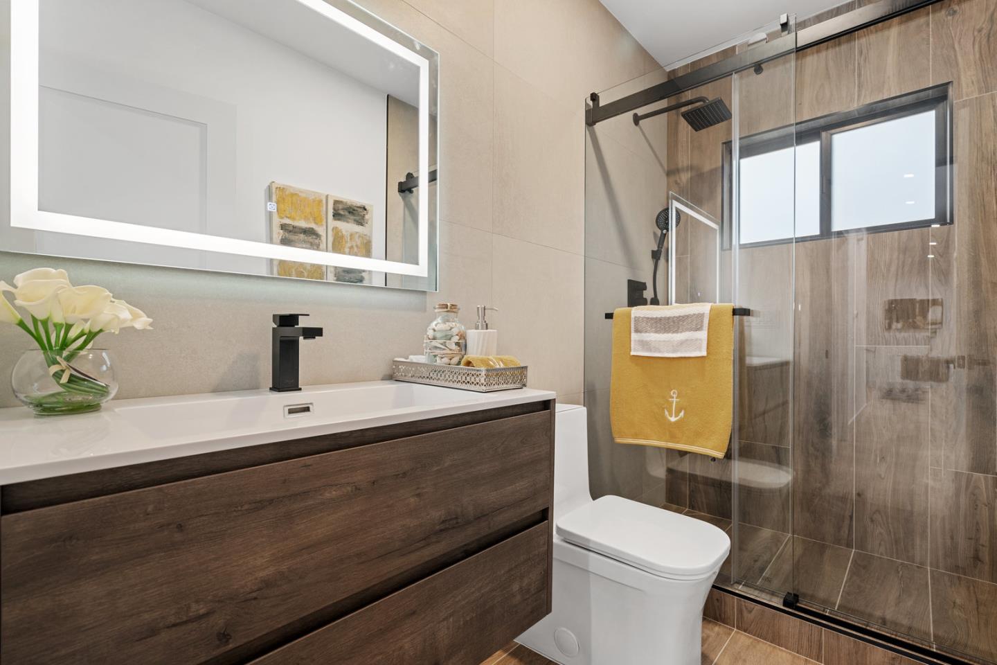 3633 Louis Road Palo Alto, CA 94303 - Photo 22 of 42 a bathroom with a sink a toilet and shower